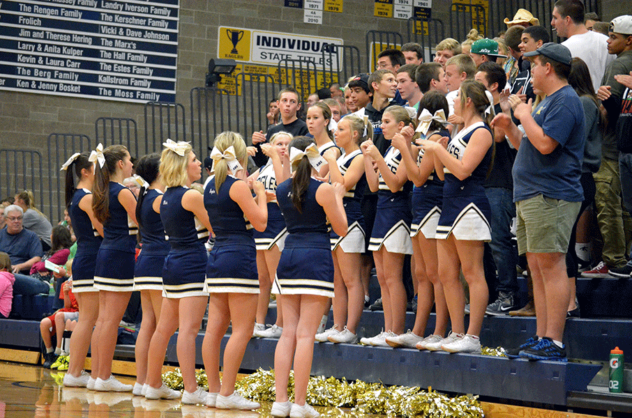 Cheerleaders and the crowd help the volleyball team beat Redmond on September 16.