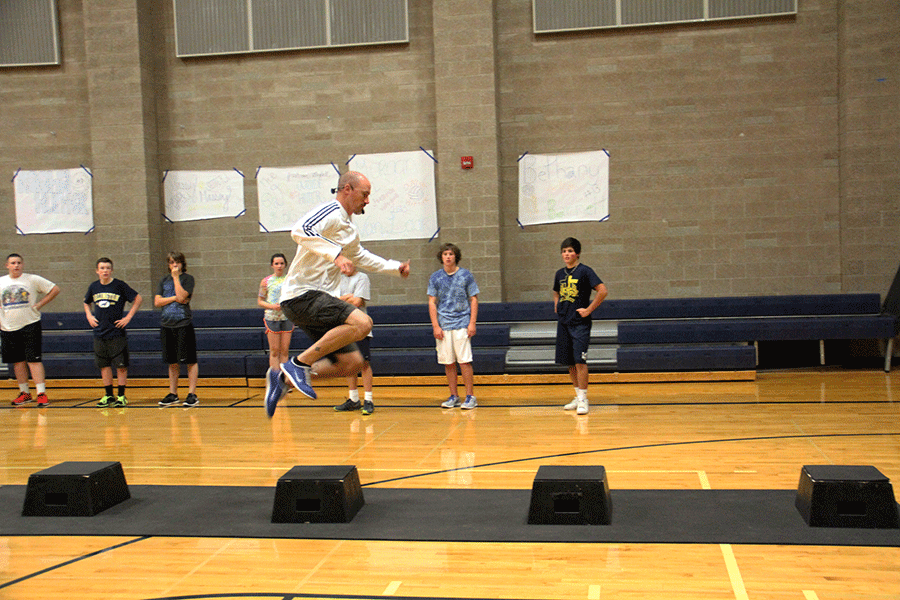 Mr Hunter shows his hops while demonstrating the obstacles for the days workout.