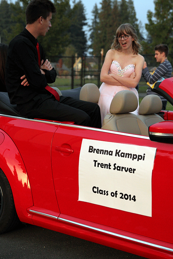Seniors Brenna Kamppi and Trent Sarver have a stare down before they ride in the Homecoming Parade on October 16.