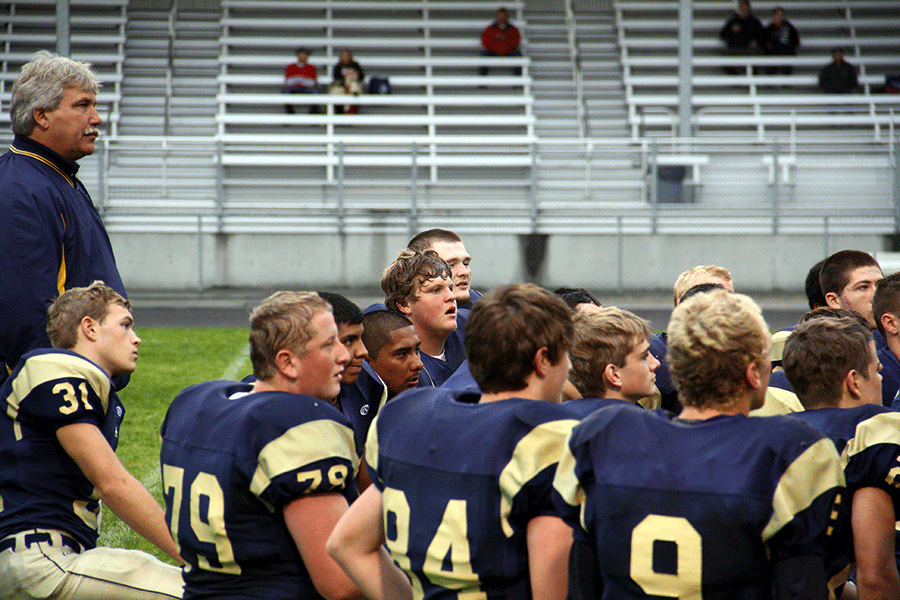 Post+game+chat+with+the+coach%3B+the+JV+football+celebrates+their+27-6+win+over+Stanwood.