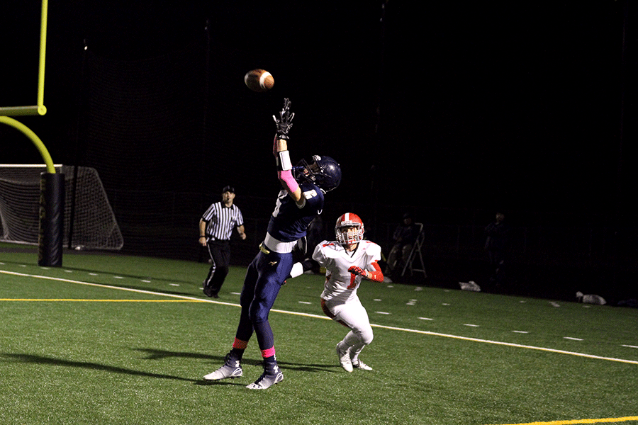 Junior Diarmuid Murphy catches a pass by Junior quarterback Drew Kalahar against Stanwood during the annual Stilly Cup.