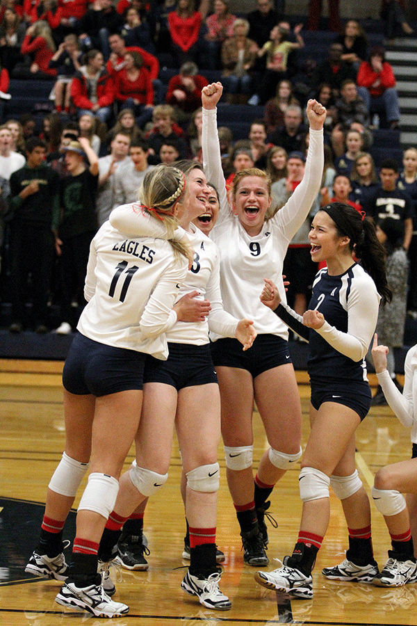 Morgan Van Laar (10), Michaela Krogen (12), Madison Ward (11), Ally Peterson (10)  and Haley Gonzales (12) celebrate after a kill during the game against Marysville Pilchuck High School Wednesday, October 29.