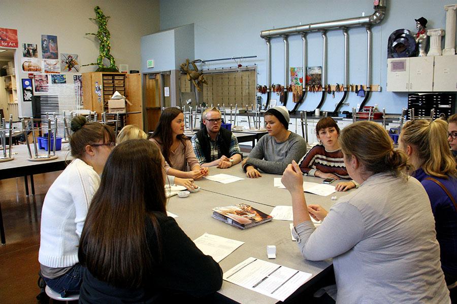 Members of the art club discuss and collaborate on ideas and decisions for the club, guided by Mrs. Palmiter