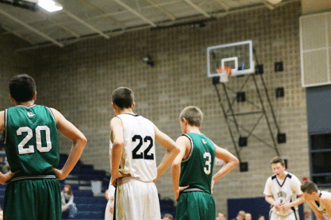 Tim Zachman (11) prepares to rebound before a free throw during the Arlington High School JV game