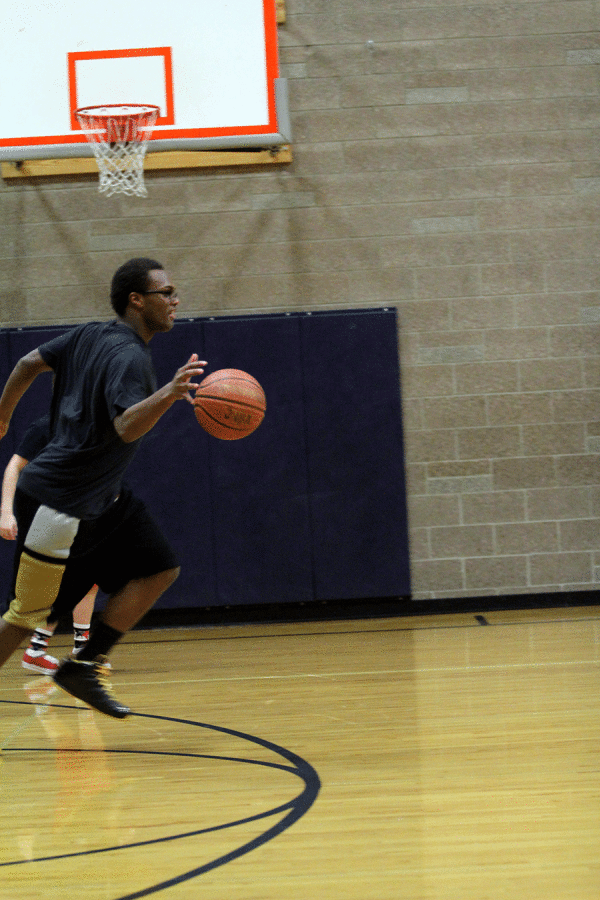 Senior Ray Jones makes a break toward the other end of the court after making a quick steal.