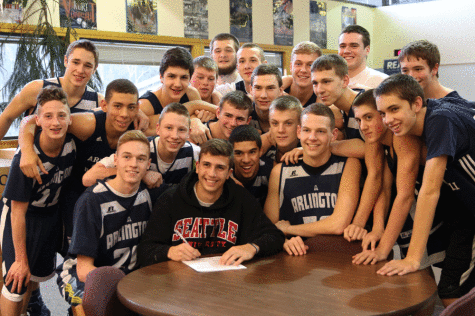 Nathan Aune (12) signs a National Letter of Intent to play soccer with Seattle University 