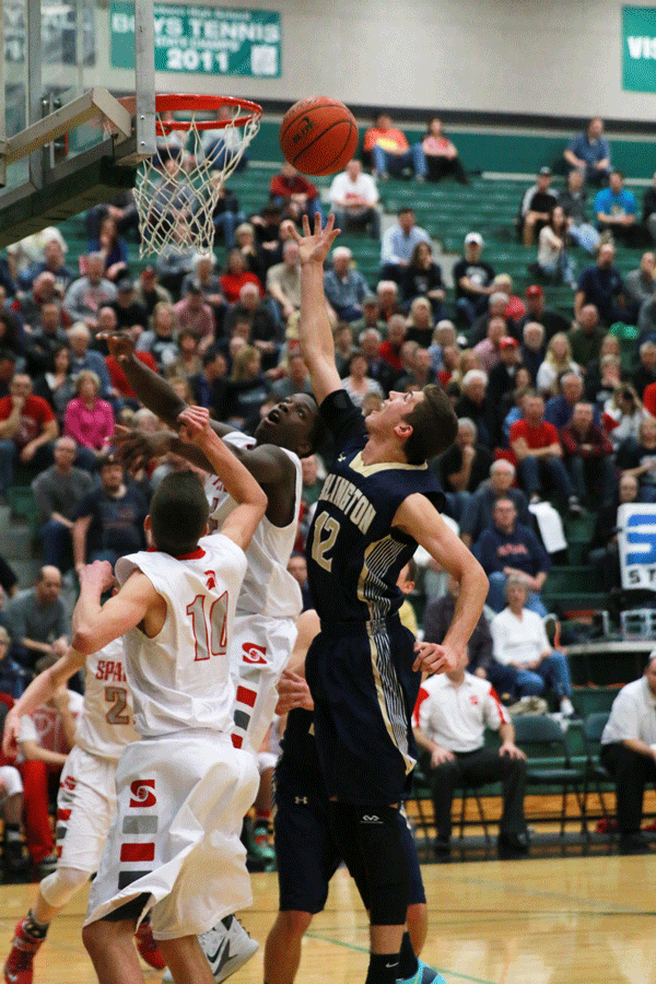 Nathan Aune 15 goes in for a shot against Stanwood High School  