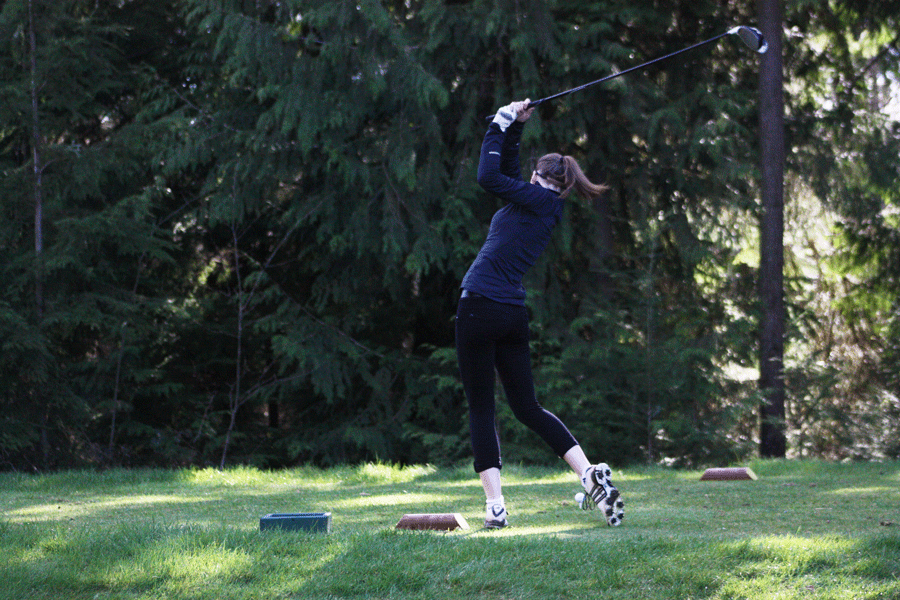 Natalie Mackey (11)  practices golfing after school on the Glen Eagle golf course