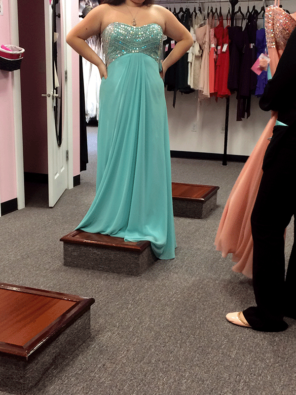 Jessica Severson 15 tries on a prom dress at Hermosas Bridal Boutique. The Junior and Senior Prom is at the EMP Museum on April 25.