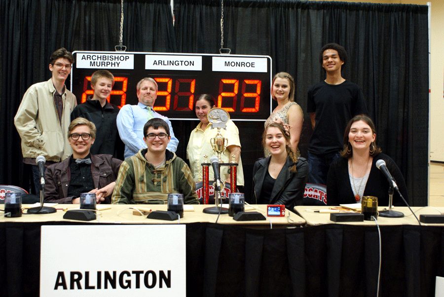 The Hi-Q team stands proudly by their trophy for state. While they came in last at nationals, they had an overall successful season.