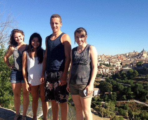 Michael Forster ’15 and Haley Gonzales ’15 stand with the cityscape of Toledo, Spain behind them during their summer trip with the Spanish class last year