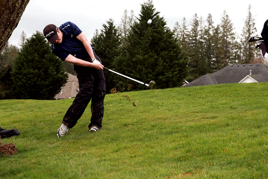 Austin Faux ‘16 drives the ball down course from the fairway.