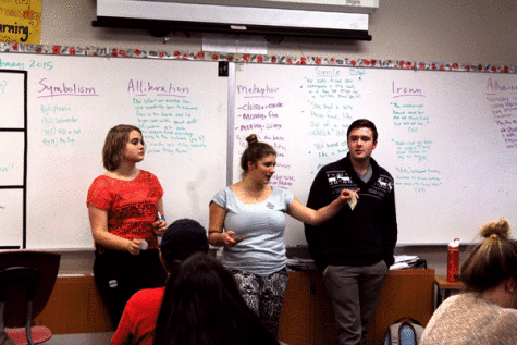 National Honor Society officers Hannah Scarth ’15, Felix Neeleman ’15, and Curtis Willett ’15 update the other members on upcoming events at a meeting in February.
