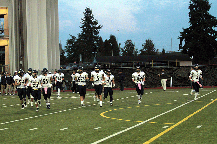 The varsity team heads onto the field in Everett for their crossover game. The team clinched the Wesco north title and face Glacier Peak on Friday, October 30.
