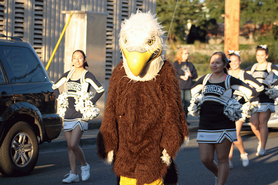 The Eagle mascot marches with the cheerleaders in the Homecoming Parade. 