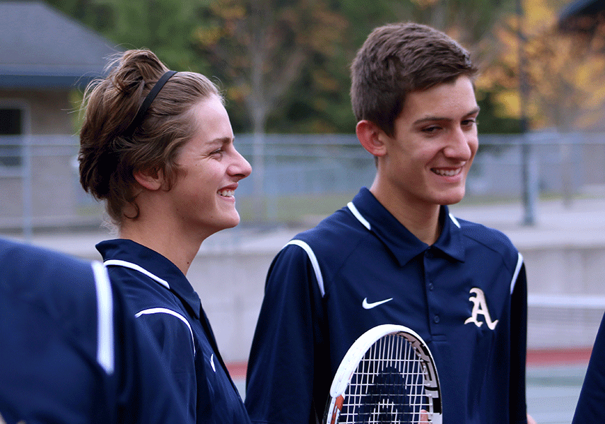 Connor Guthrie (17) and Wren Pullig (17) loosening up during the pre-game huddle.