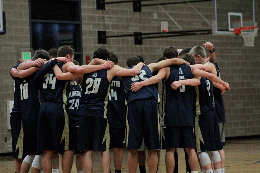 Members of the Arlington Basketball team huddle after a workout on November 24th. 