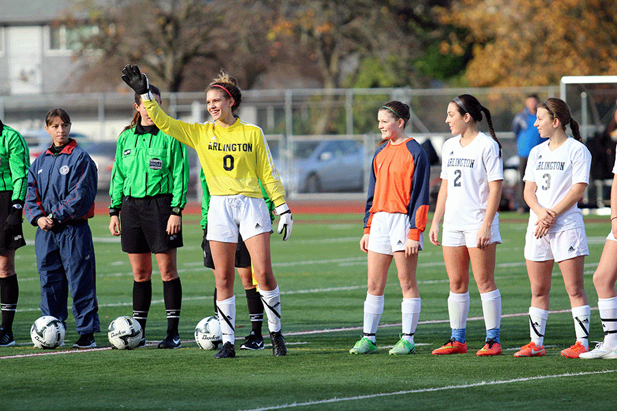 Goalkeeper Kat Sanchez (16) waves to the crowd during introductions at the state soccer meet on November 20th. 
