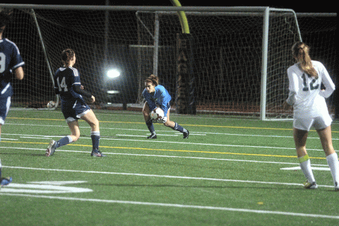 Senior Kat Sanchez stops a ball in the rainy game against Edmonds Woodway on Saturday, November 7.