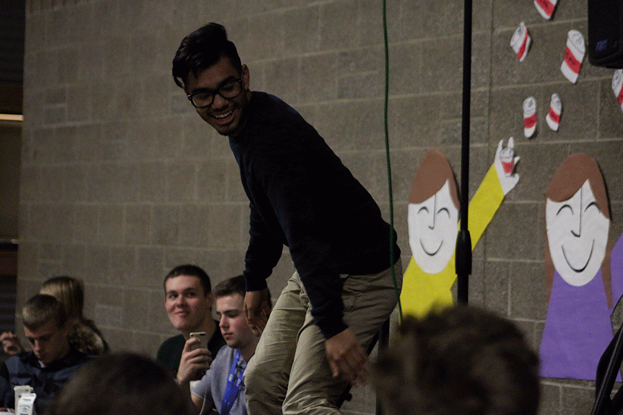 Aaron Paloalto (16) dances during a lunch time activity to raise funds for the food drive. 