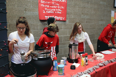 Members of DECA sell hot chocolate and apple cider during first lunch on December 2nd. All proceeds benefit local Arlington families. 