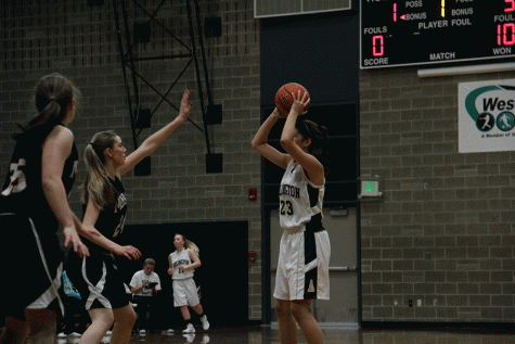 Hannah Carlson ('18) looks to pass the ball during the JV Girls basketball game on December 2nd. 