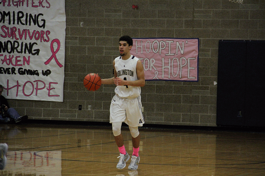 Donavan Sellgren (16) dribbles down the court during the Coaches Vs. Cancer game on January 8th.