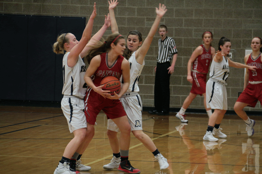 Seniors Emma Janousek and Olivia Larson double team a member of Stanwoods basketball team during a game on January 15th.