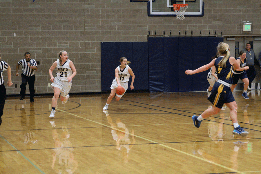 Emma Janousek (16) and Sarah Shortt (16) looks up the court during a home game against Everett. 