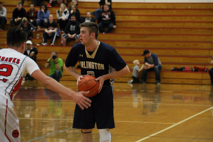 Senior Tylor Morton looks for an open man during Tuesday night's game against Marysville-Pilchuck. 