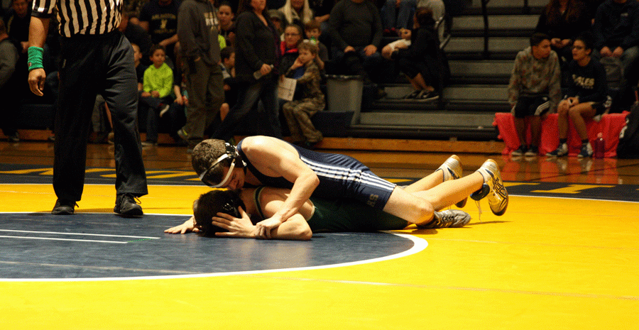 Ben Rosenthal (16) pins an opponent during a wrestling match held at AHS on January 26th. 