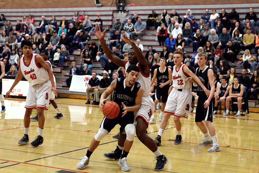 Donavan Sellgren posts up on Mountlake Terraces Derek Anyimah in the opening round of the District Playoffs. Sellgren led all scorers with 20 points on the night. 