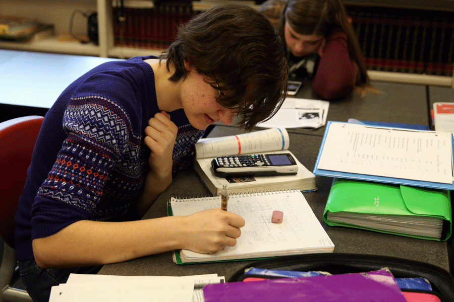 Sarah Boatman (17) works on a set of math problems in class. 