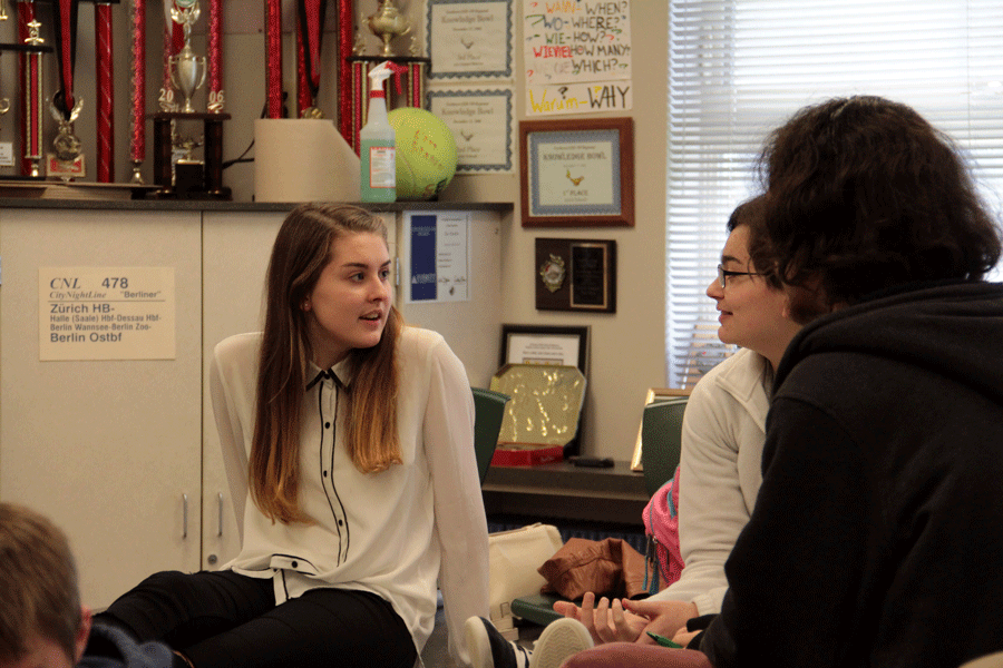 Juniors Aysia Brenner, Lily Janda, and Robert Green discuss answers during Knowledge Bowl practice on February 22nd. Knowledge Bowl's "A" team will compete at State on March 19th. 