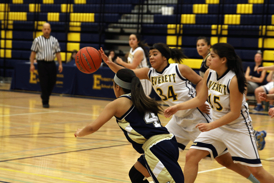 Jaynee Dauz (17) tries to steal a ball from an Everett player during a game on February 5th. 