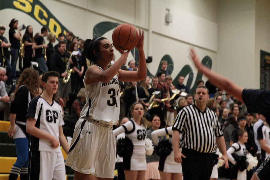 Jayla Russ (16) prepares sto shoot a three-pointer during Wednesday nights playoff game against Glacier Peak.