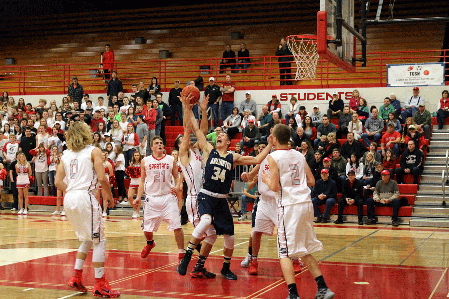 Brennon Wiersma (16) battles for the rebound in a loss against Stanwood in Arlingtons final game of the year. 