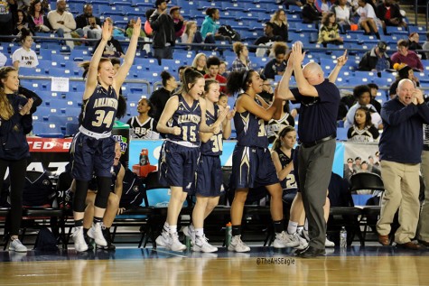 The Arlington girls basketball team cheers as they defeat Lincoln on March 3rd at the Tacoma Dome.