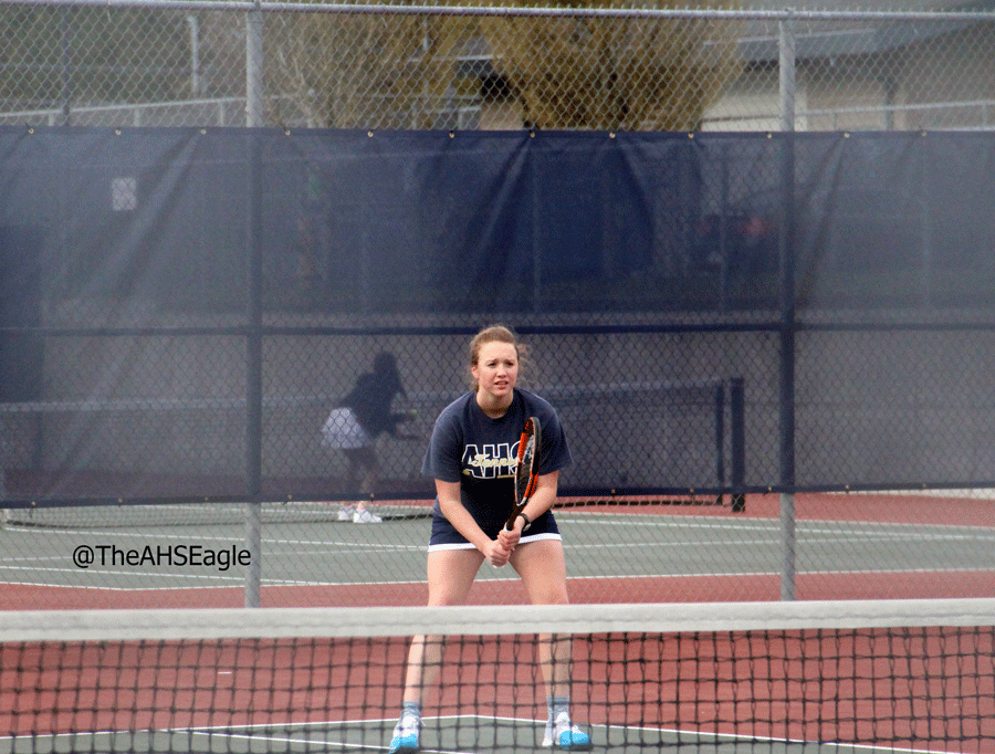 Jessica Abraham ('17) gets ready for a serve in a doubles match against Mountlake Terrace. 