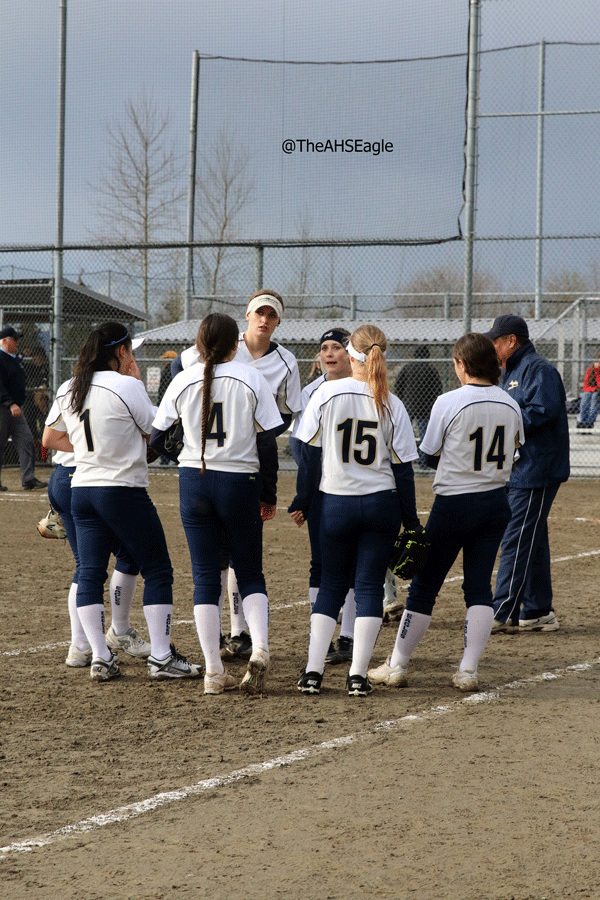 The AHS softball team huddles up during a game against Snohomish on March 21st. 
