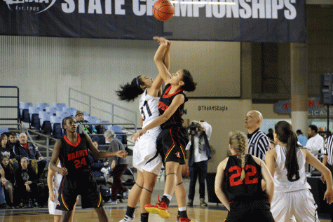 Jayla Russ (16) goes up for the tipoff during Friday nights state tournament game against Kamiakin. 