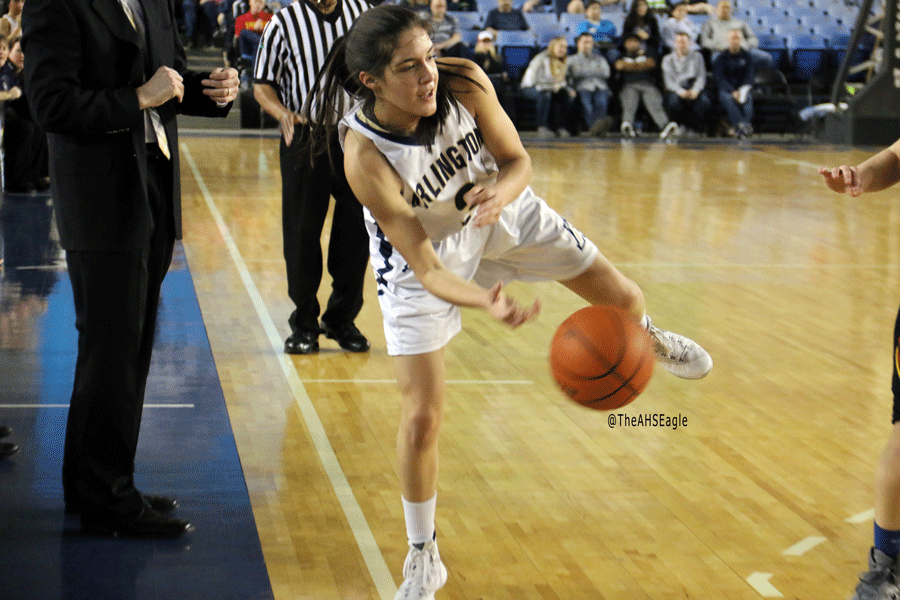 Gracie Castaneda ('16) sends the ball back into bounds during Friday night's playoff game against Kamiakin. 
