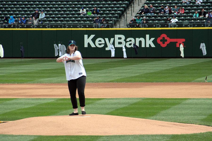 Megan Chapman ('16) delivers the first pitch at DECA Pro Sports Day at Safeco Field as the Seattle Mariners took on the Texas Rangers.