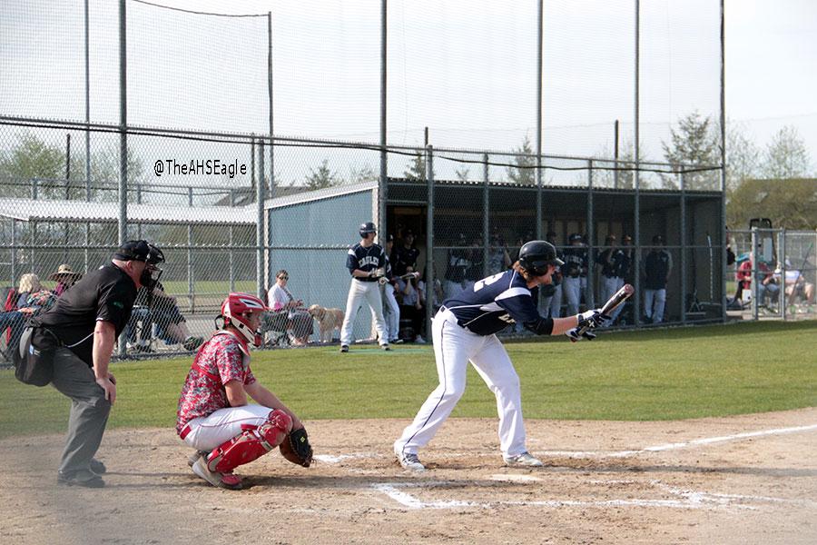 Drew Carlson ('16) tries to put down a bunt during a game against Stanwood on April 8th. Carlson would later single in the at-bat.