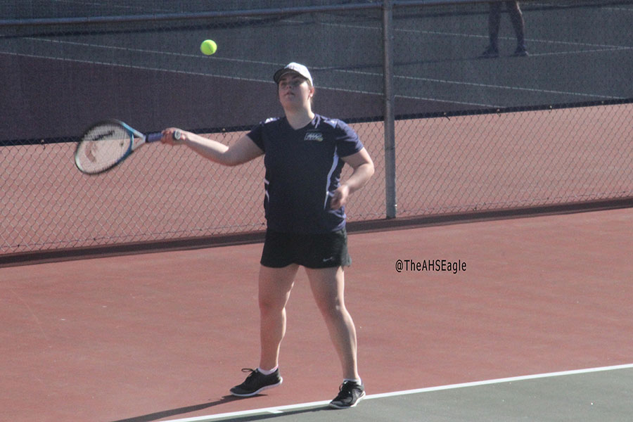 Emily Songster ('17) hits a forehand in a match against Everett. 