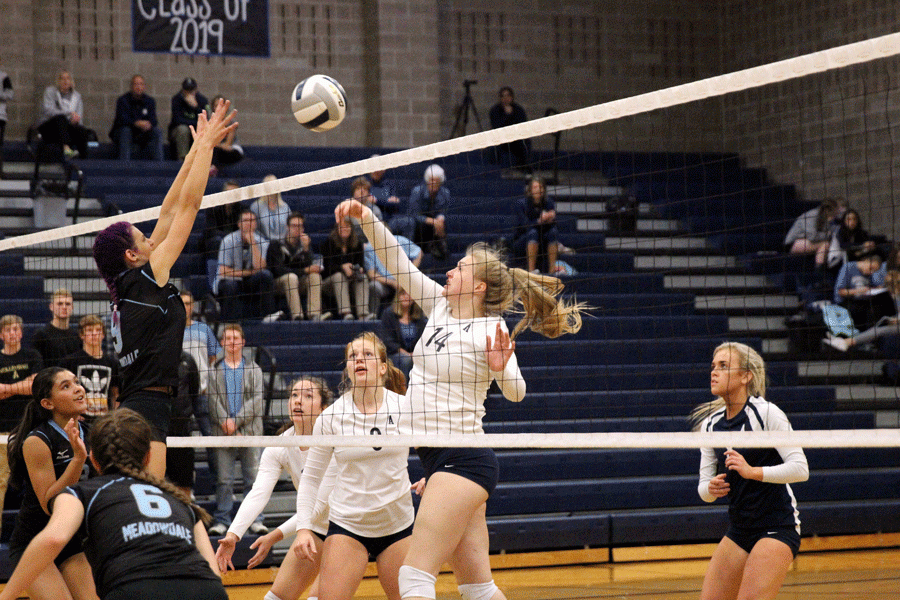 Madison Burkett ('17) slams the ball into front center court. They win 3-0 against Meadowdale.