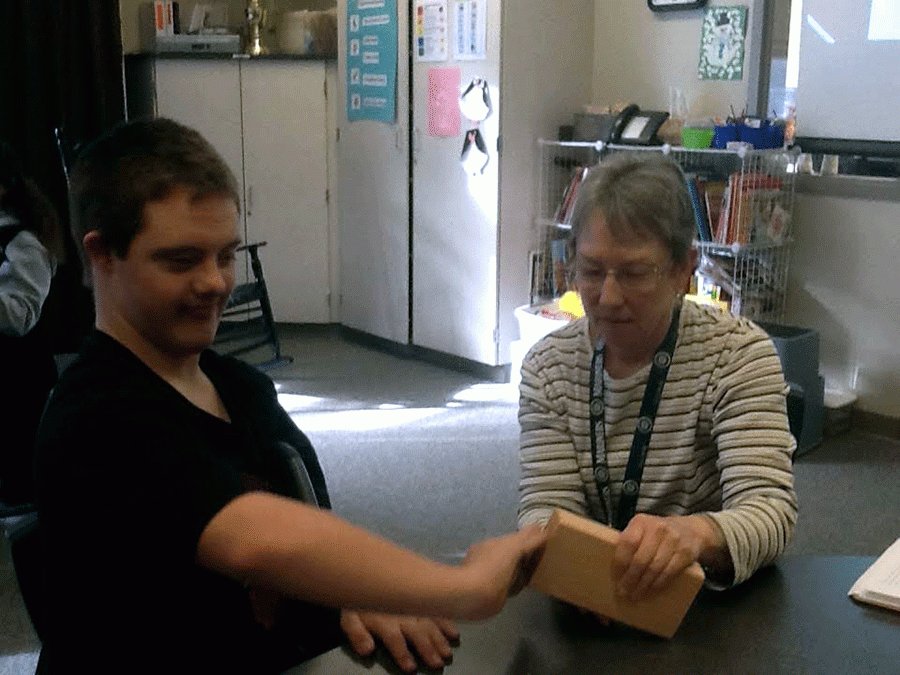 Hayden Smith (18) and Ms.Freeman work together on their American Flag Fundraiser.