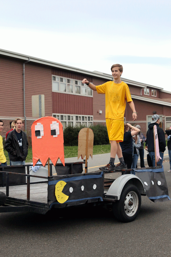 Caleb Abenroth ('19) stands on the Sophomore's Pacman-themed float before the homecoming parade on Wednesday, October 12th.