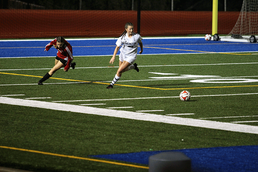 November 5th at Shoreline Stadium, Junior Defender Kristin Abraham #21 races after the ball during the first half of the game against Snohomish. Arlington went on to win 1-0, being the first girls soccer team in Arlington history to win the district title. 