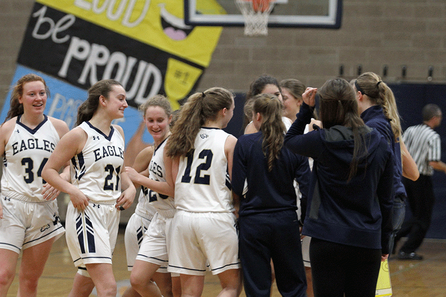 Arlington Girls Basketball celebrates during a time-out in the fourth quarter after they gain the lead for the first time since the first quarter on Wednesday, December 7. 